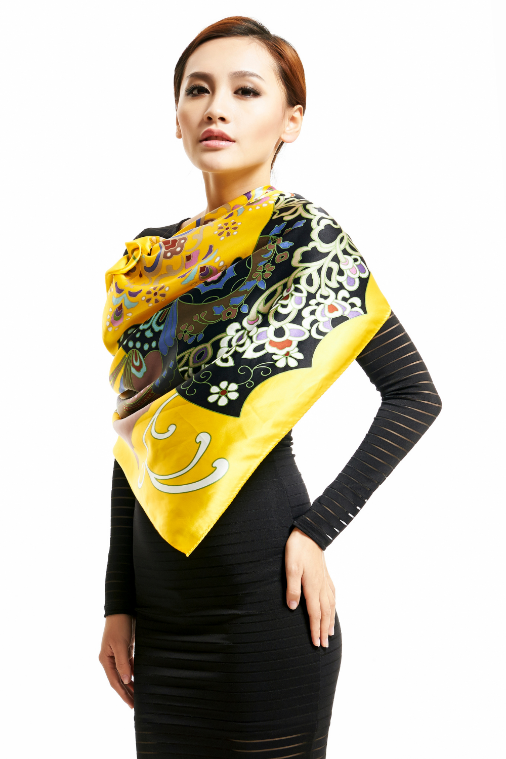 asian model wearing colorful scarf draped over black dress