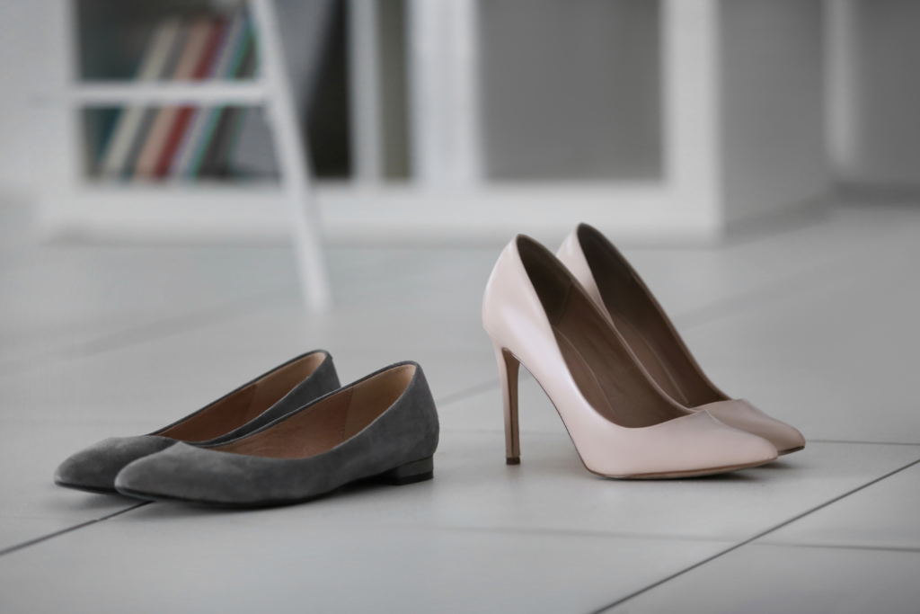 gray suede ballet flats and light pink high heel pumps that are appropriate for the office