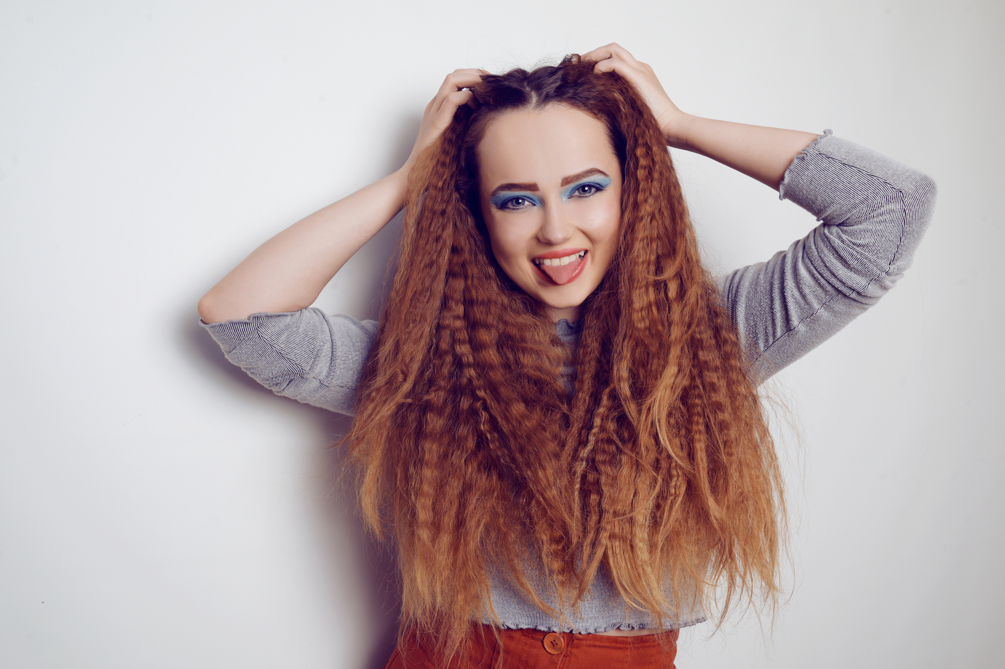 Girl with red crimped hair in true 1980s fashion.