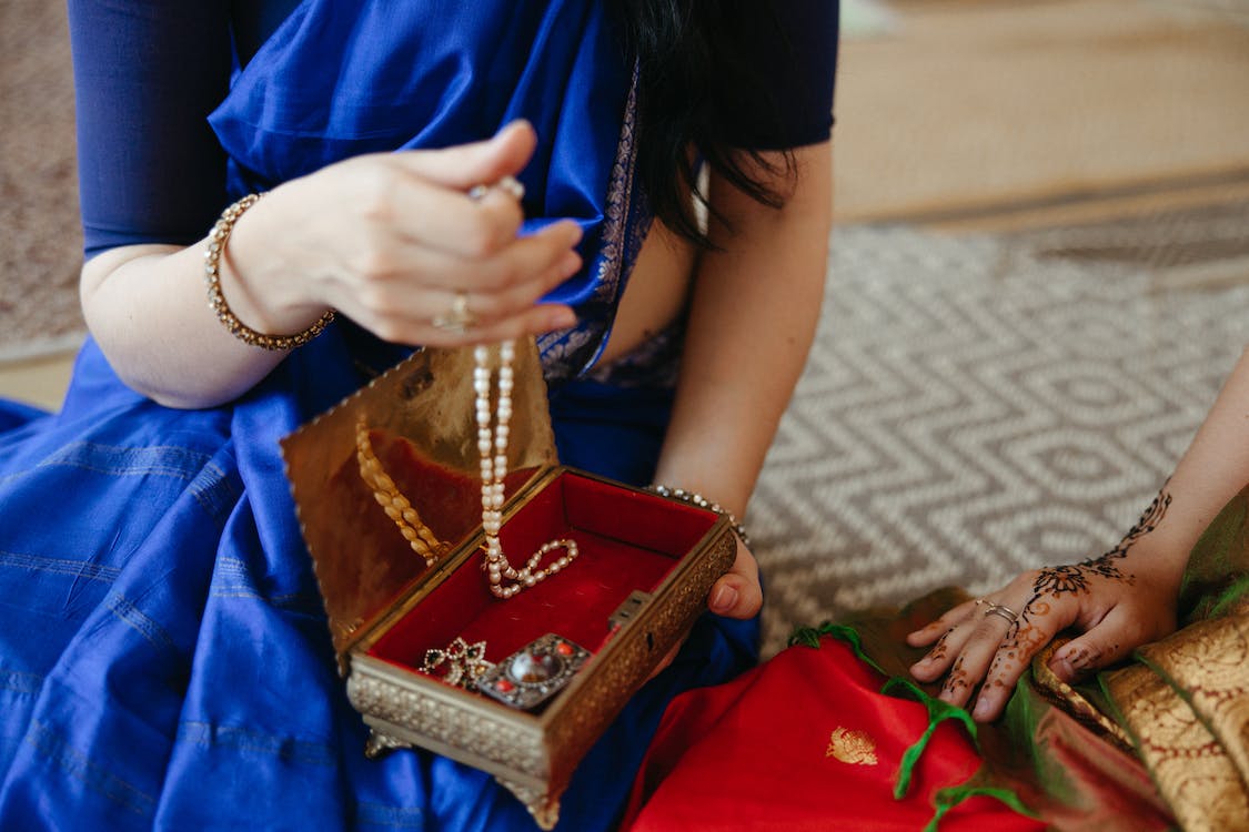 A girl holding a jewelry box.