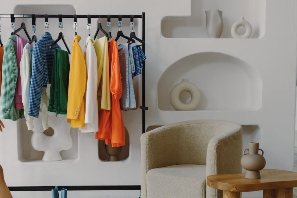 Colorful clothes in a minimalistic closet.