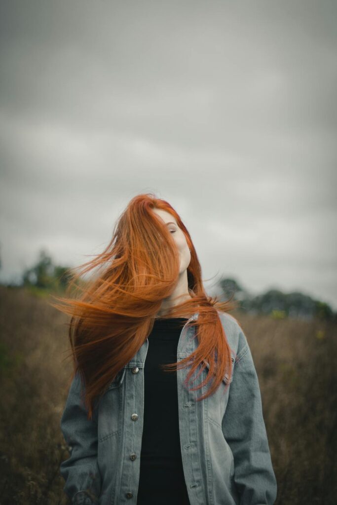 woman with long Terracopper Red Haircolor