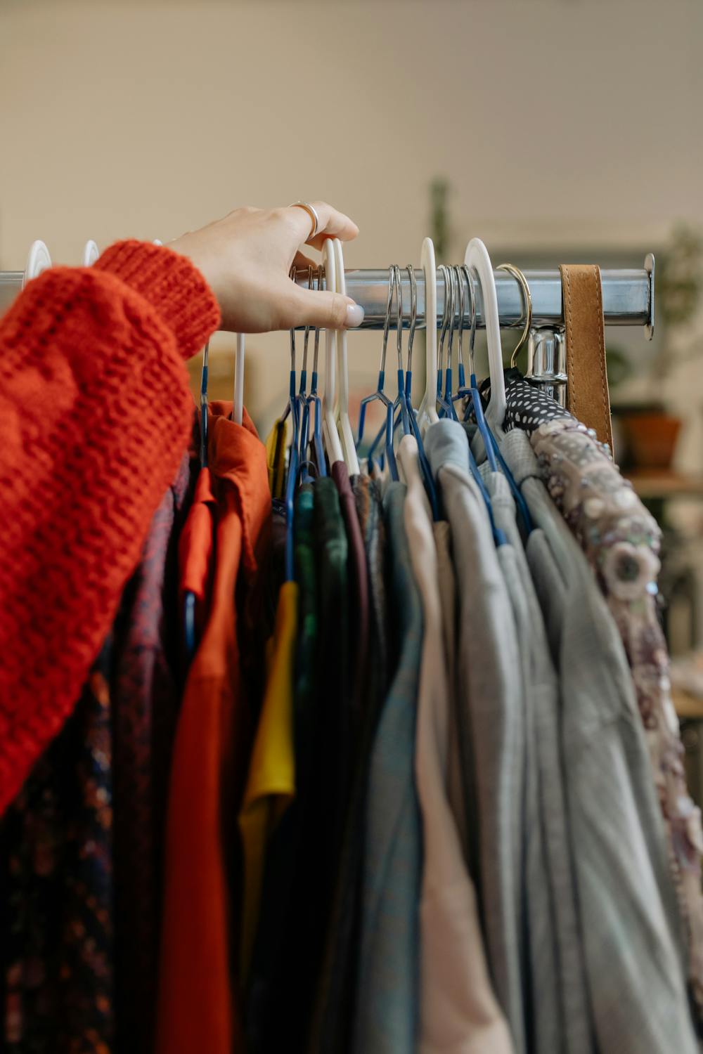 Person looking through clothes.