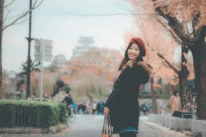 a woman thinking about how to avoid fashion faux pas when living in Japan